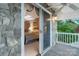 Main bedroom suite with sliding glass door access to the back porch and stone accents at 192 Diana Dr, Mount Gilead, NC 27306