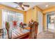 Inviting dining room featuring wooden table set, overhead lighting, with adjacent bathroom at 2026 Harvest Ln, Charlotte, NC 28210