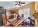 Sunlit dining room with wooden table, adjacent to kitchen with wood cabinets and a black refrigerator at 2026 Harvest Ln, Charlotte, NC 28210