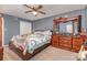 Comfortable primary bedroom with carpet, a ceiling fan, and light blue walls at 2026 Harvest Ln, Charlotte, NC 28210