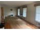 Spacious living room with hardwood floors and large windows offering plenty of natural light at 205 Rudolph Rd, Salisbury, NC 28146