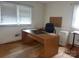 A home office featuring hardwood floors, natural light, and built-in storage at 205 Rudolph Rd, Salisbury, NC 28146