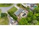 Aerial view of a home featuring a spacious backyard, a pool and a two car garage at 213 Lakeview Dr, Harrisburg, NC 28075