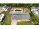 Aerial view of a home featuring a spacious backyard, a pool and a two car garage at 213 Lakeview Dr, Harrisburg, NC 28075