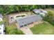 Aerial view of a home featuring a spacious backyard, a pool and a two car garage at 213 Lakeview Dr, Harrisburg, NC 28075