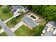 Aerial view of a home featuring a spacious backyard, a pool and a two car garage at 213 Lakeview Dr, Harrisburg, NC 28075