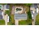 Aerial view of a home featuring a spacious backyard, a pool and a two car garage at 213 Lakeview Dr, Harrisburg, NC 28075