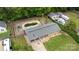 Aerial view of a home featuring a spacious backyard, a pool and a two car garage at 213 Lakeview Dr, Harrisburg, NC 28075