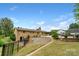 Spacious backyard with patio area, fence, and lush greenery at 213 Lakeview Dr, Harrisburg, NC 28075