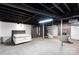 The basement features a bedroom, plenty of storage, and a cozy seating area for ultimate relaxation at 213 Lakeview Dr, Harrisburg, NC 28075