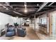 Basement with bar area, TV entertainment section, and cozy lounge for relaxing or entertaining at 213 Lakeview Dr, Harrisburg, NC 28075