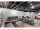 Finished basement with painted ceilings, neutral furniture, and stair access at 213 Lakeview Dr, Harrisburg, NC 28075