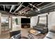 Basement featuring a TV entertainment area with comfortable seating and bar area at 213 Lakeview Dr, Harrisburg, NC 28075