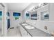 Bright bathroom with double vanity, neutral finishes, and window at 213 Lakeview Dr, Harrisburg, NC 28075