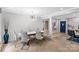 Modern dining room with textured wall and updated lighting provides an open feel at 213 Lakeview Dr, Harrisburg, NC 28075