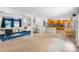 Open-concept living room with modern decor flows into an eat-in kitchen with wood cabinets at 213 Lakeview Dr, Harrisburg, NC 28075