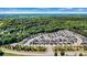 Overhead shot of a new suburban development surrounded by lush greenery at 213 Warbler Dr, Monroe, NC 28110