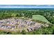 Expansive view shows residential neighborhood surrounded by green, wooded areas at 213 Warbler Dr, Monroe, NC 28110