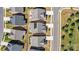Top-down view of homes, illustrating rooftops and landscaped yards in a residential area at 213 Warbler Dr, Monroe, NC 28110