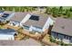 Aerial view of a backyard with a patio seating area, garden, and black metal fencing at 213 Warbler Dr, Monroe, NC 28110