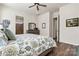 Comfortable bedroom with hardwood flooring, leading to an open en suite bathroom at 213 Warbler Dr, Monroe, NC 28110