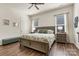 Charming bedroom with a decorative bed, hardwood flooring, and windows for natural light at 213 Warbler Dr, Monroe, NC 28110