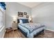 Cozy bedroom featuring a comfortable bed, bedside tables, and lovely decor, perfect for relaxation at 213 Warbler Dr, Monroe, NC 28110