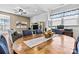 This dining room includes an adjacent living room with a large, comfortable couch and a mounted television at 213 Warbler Dr, Monroe, NC 28110