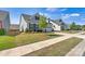 Lovely home with a well-manicured lawn, beautiful landscaping, and a two-car garage at 213 Warbler Dr, Monroe, NC 28110