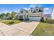 Attractive house boasting a two-car garage, tasteful landscaping, and an American flag at 213 Warbler Dr, Monroe, NC 28110