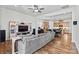 Inviting living room featuring a comfortable couch and an open floor plan to the kitchen at 213 Warbler Dr, Monroe, NC 28110