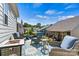 Relaxing patio with comfortable seating, outdoor decor, and views of the surrounding neighborhood at 213 Warbler Dr, Monroe, NC 28110