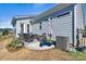 Outdoor patio featuring comfortable seating, stylish decor, and a well-maintained exterior at 213 Warbler Dr, Monroe, NC 28110