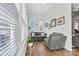 Cozy sitting area with hardwood floors and bright lighting from large windows at 213 Warbler Dr, Monroe, NC 28110