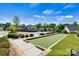 Well-maintained bocce ball court surrounded by lush landscaping, offering a recreational amenity for community enjoyment at 213 Warbler Dr, Wesley Chapel, NC 28110