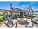 Stunning clubhouse featuring an inviting outdoor fire pit and ample seating, perfect for entertaining and relaxation at 213 Warbler Dr, Wesley Chapel, NC 28110
