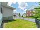Backyard with a black metal fence and lawn at 2305 Blueberry St, Belmont, NC 28012