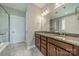 Bathroom with double vanity sinks, granite counters, and a glass shower at 2305 Blueberry St, Belmont, NC 28012