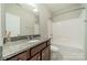 Bathroom featuring granite counters, stylish vanity, and a bathtub with shower at 2305 Blueberry St, Belmont, NC 28012