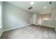 Carpeted bedroom with neutral walls, a loft access, and a view of the staircase at 2305 Blueberry St, Belmont, NC 28012