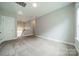 Bright carpeted bedroom with a loft access and staircase view at 2305 Blueberry St, Belmont, NC 28012