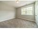 Bright, carpeted bedroom with a window at 2305 Blueberry St, Belmont, NC 28012
