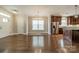Bright living area seamlessly flows into the kitchen featuring hardwood floors and stainless steel appliances at 2305 Blueberry St, Belmont, NC 28012