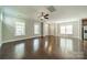 Open living space boasts hardwood floors, neutral paint, and seamless flow for entertaining and relaxation at 2305 Blueberry St, Belmont, NC 28012