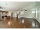 Open-concept space features hardwood floors, a kitchen with island, and natural light, perfect for modern living at 2305 Blueberry St, Belmont, NC 28012