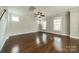 Bright living room offers hardwood floors, neutral paint, and a ceiling fan at 2305 Blueberry St, Belmont, NC 28012