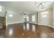 Spacious living room boasts gleaming hardwood floors, ceiling fan and ample natural light at 2305 Blueberry St, Belmont, NC 28012
