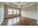 Bright main bedroom featuring hardwood floors and large windows at 2305 Blueberry St, Belmont, NC 28012