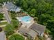 Aerial view of pool, playground, landscaping, and clubhouse at 2305 Blueberry St, Belmont, NC 28012