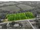 Aerial view showing property lines of a wooded lot adjacent to an existing house and field at 2474 Cedar Valley Dr, Conover, NC 28613